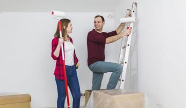 couple painting the walls